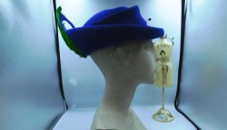 blue hat green feather side